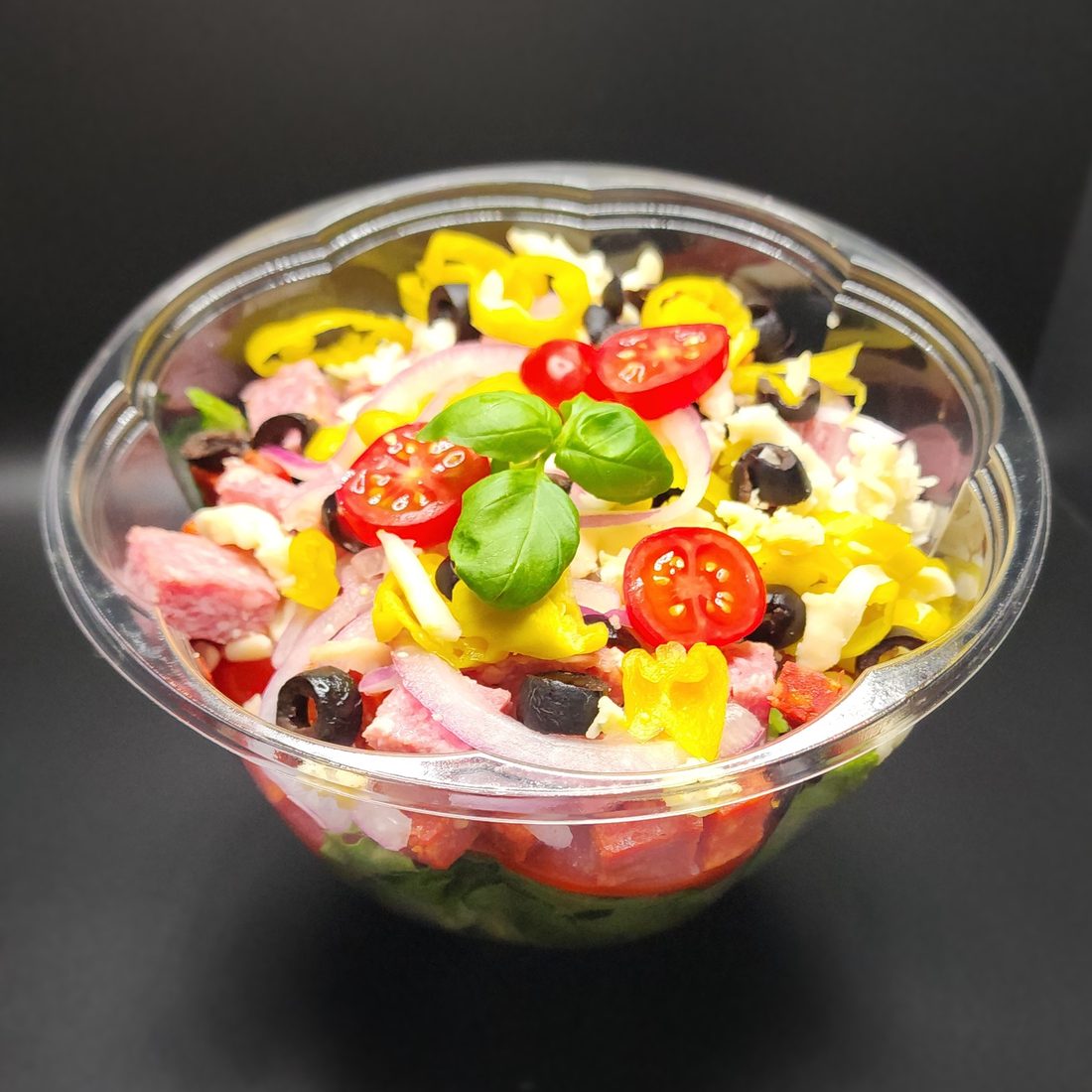 Antipasto salad with salami, olives, pepperoncini and tomato