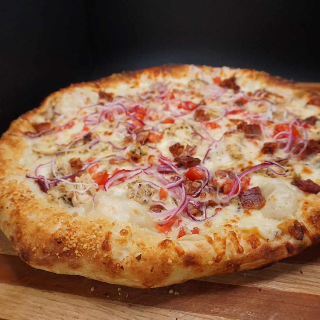 Chicken pizza with red onion at Blue Buffalo Pizzeria